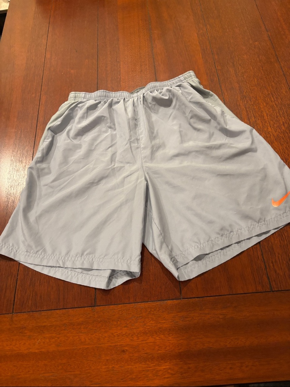 Nike Light Gray Men’s Athletic Shorts with Orange Swoosh Size M